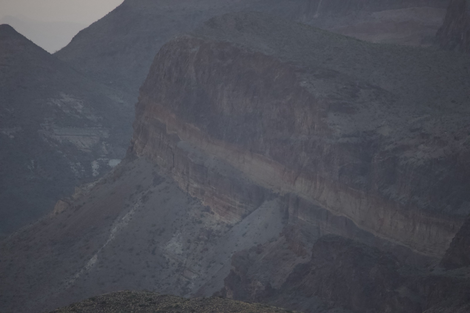 Dawn Over Arid Canyon Cliff