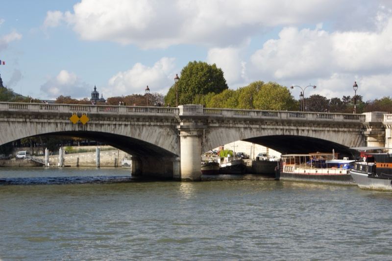 Stone Bridge Over River Under Cloudy Sky