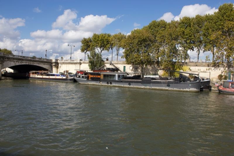 River barges under bridge Paris