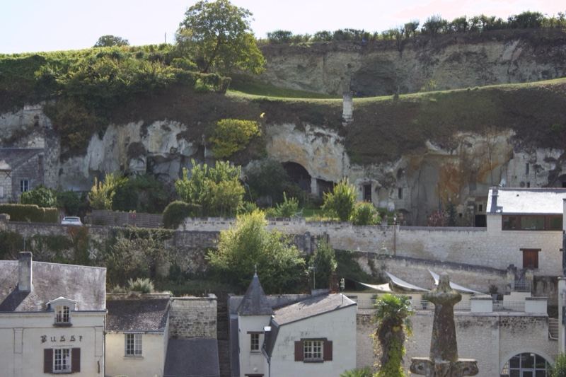 Village beneath limestone cliffs