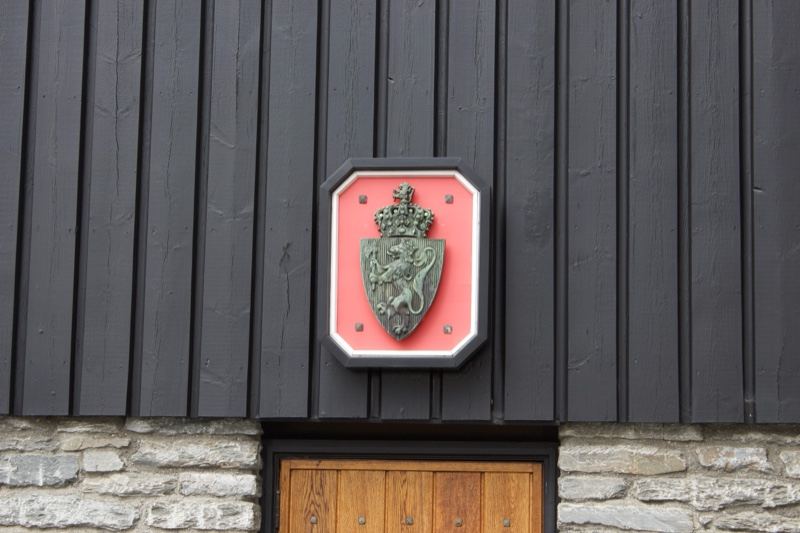Crest Plaque Above Wooden Door
