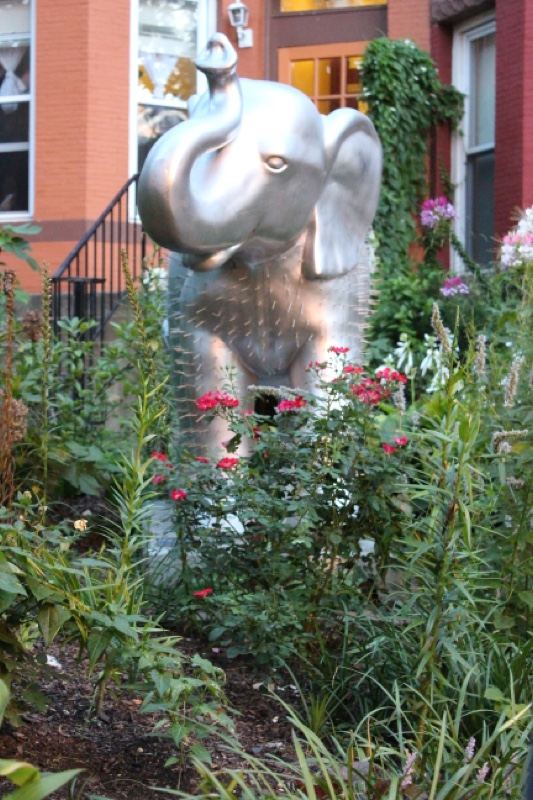 Silver Elephant Statue in Urban Garden