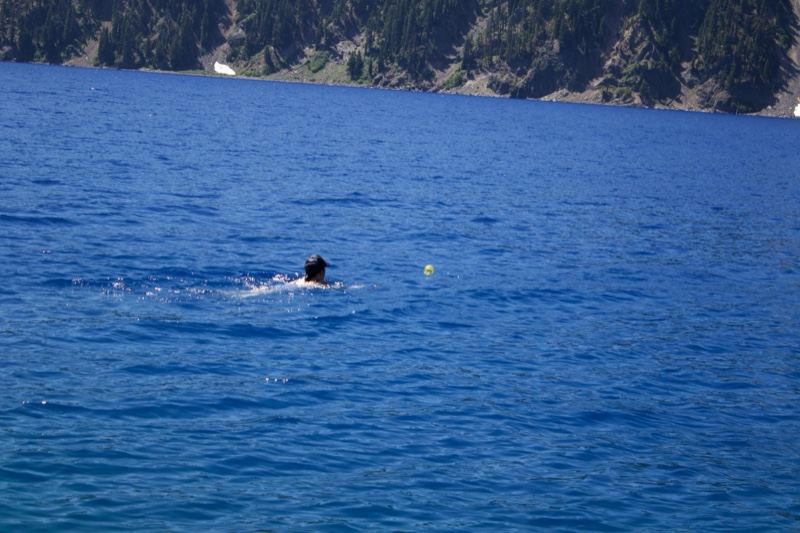 Swimmer in Deep Blue Alpine Lake