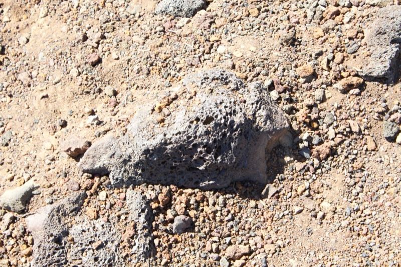 Porous rock on arid gravel ground