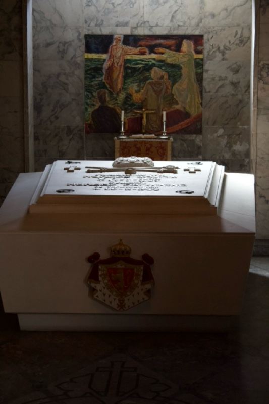 White sarcophagus in church interior