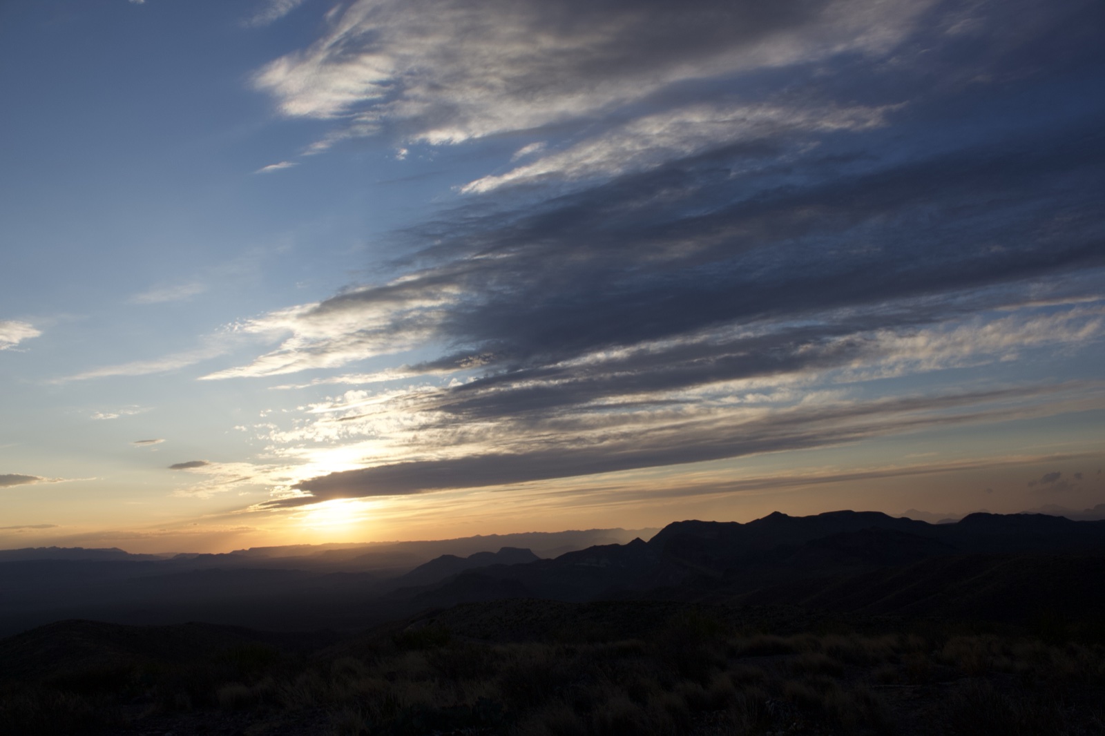 Sunset over mountain silhouette