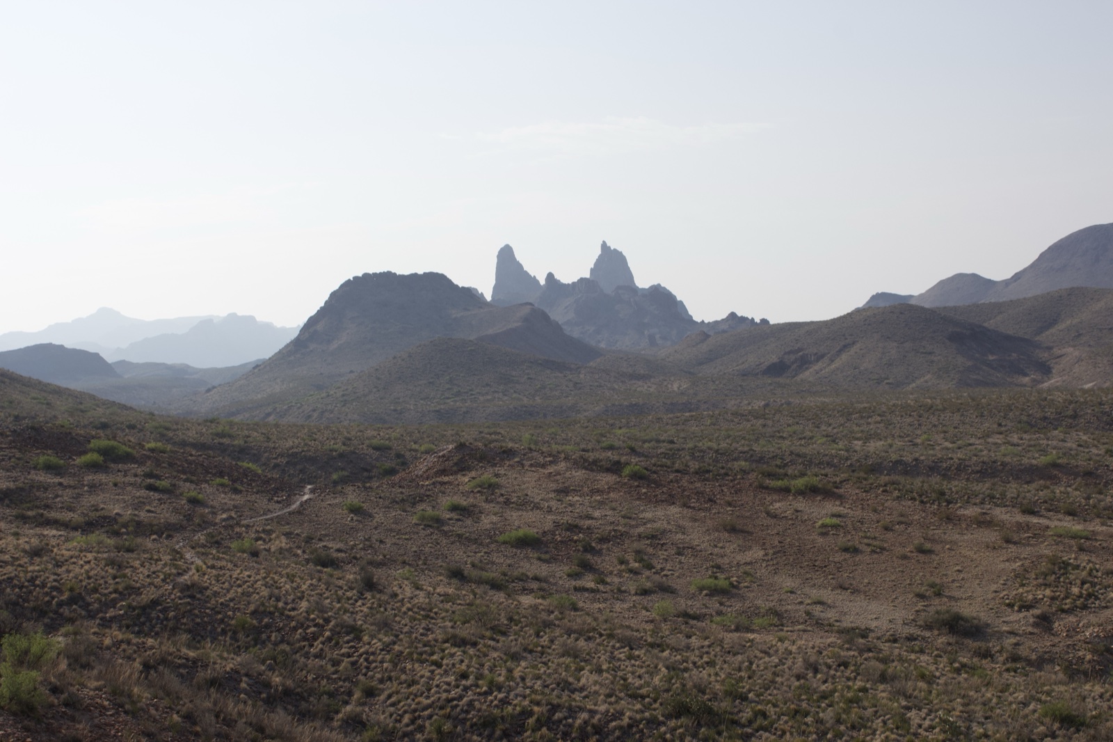 Arid Desert Mountains Under Hazy Sky