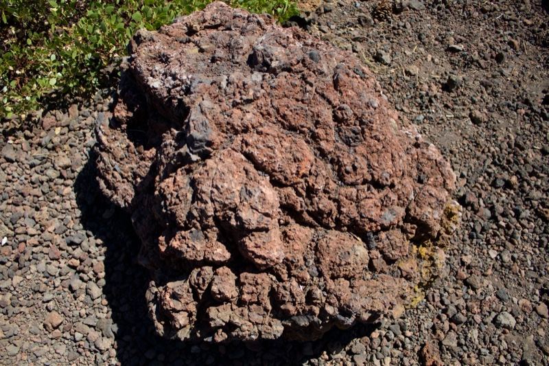 Reddish Volcanic Rock on Gravel