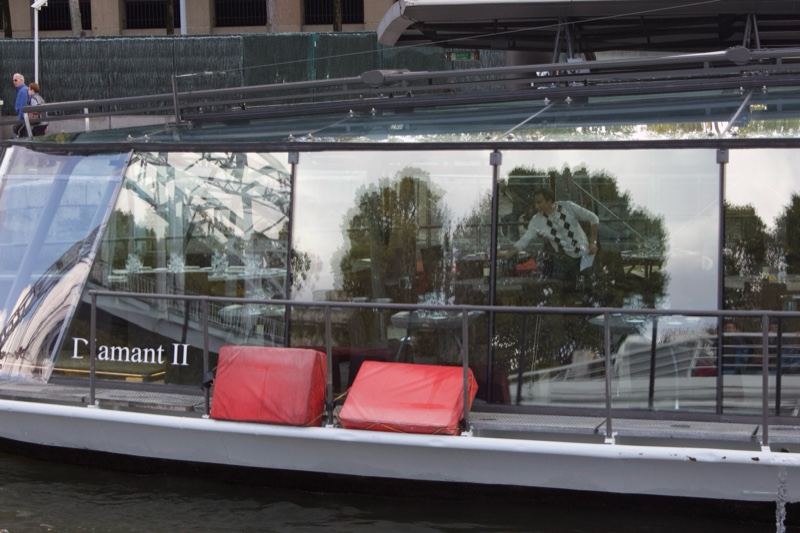 Glass boat L'amant II on water