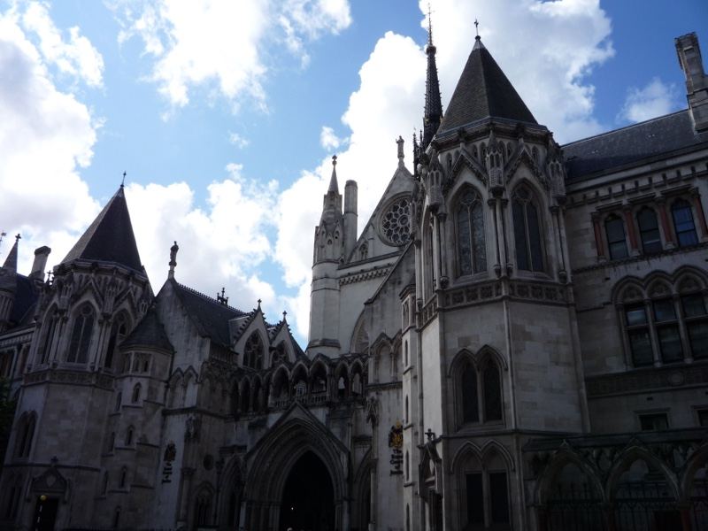 Gothic Courthouse Facade Under Cloudy Sky