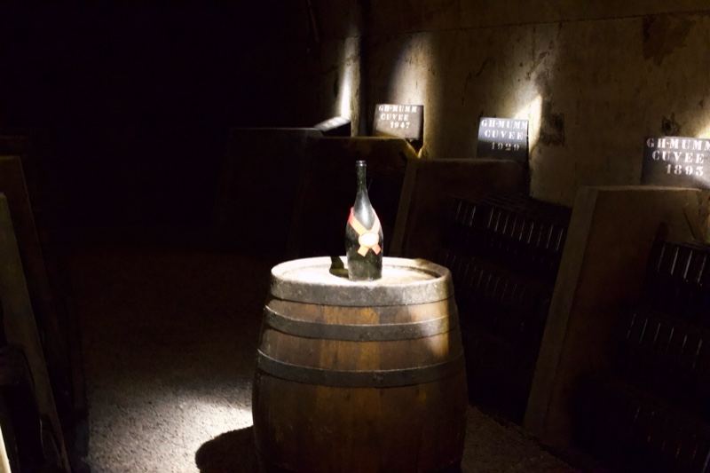 Wine Bottle on Barrel in Cellar