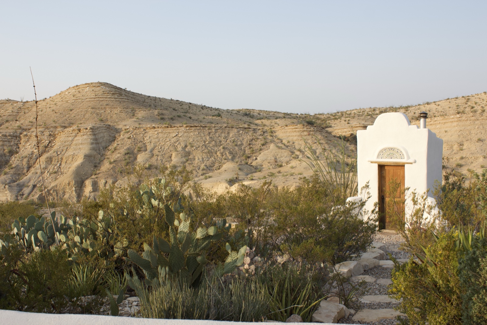 White chapel in desert landscape