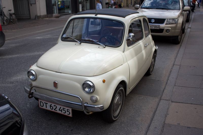 White Vintage Fiat 500 Parked Urban Street