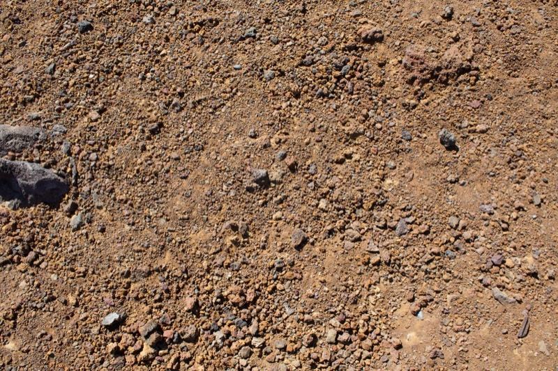 Dry reddish-brown rocky soil