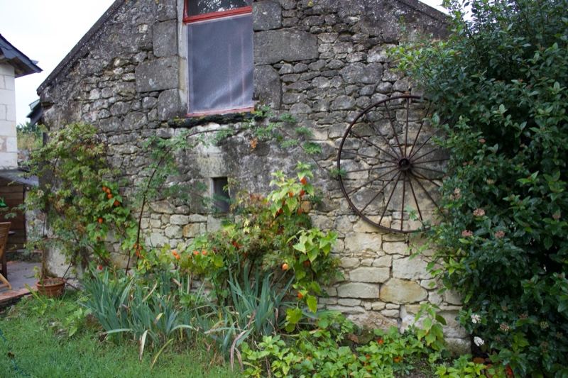 Rustic Stone Farmhouse With Wagon Wheel