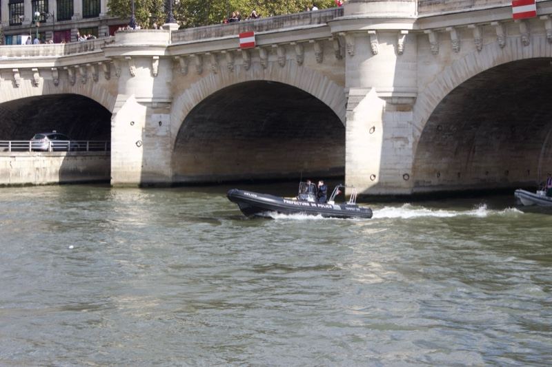 Inflatable Boat Under Paris Stone Bridge