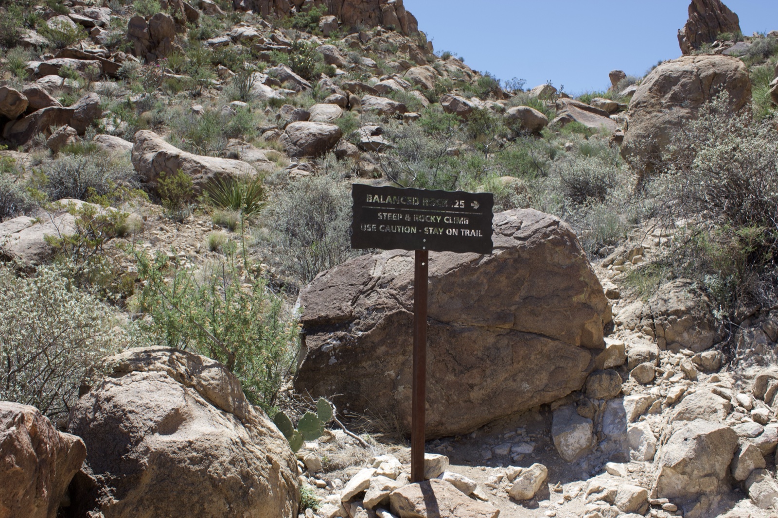Desert Trail Sign on Rocky Hillside