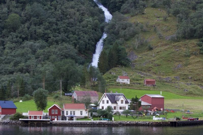 Rural Fjord Village With Waterfall