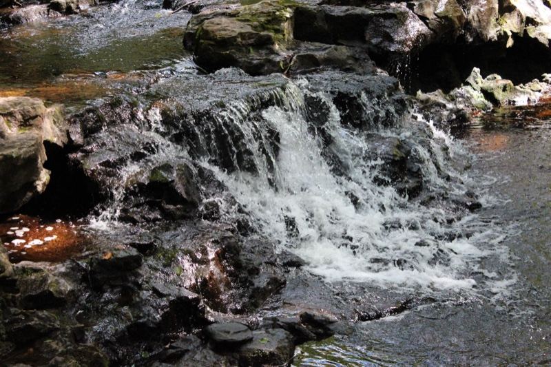 Small waterfall over rocky stream