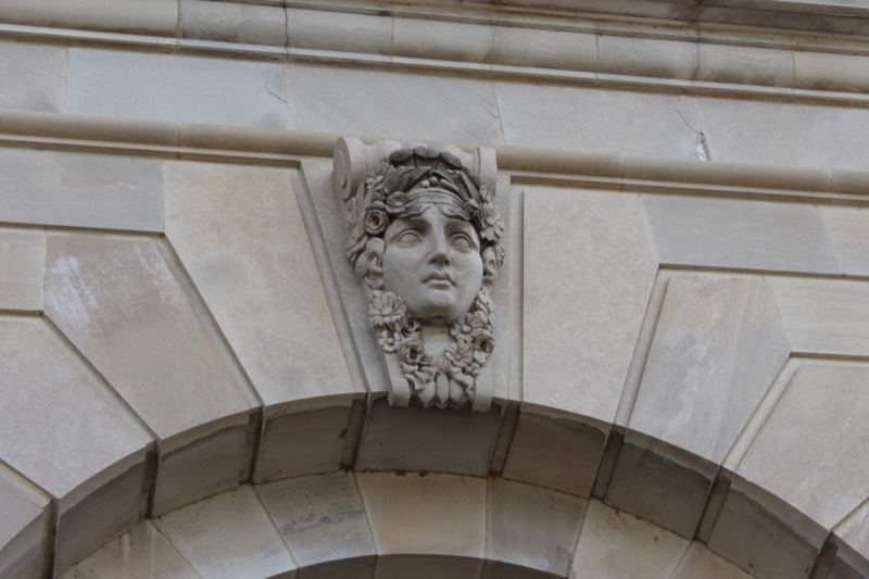 Stone mascaron on building facade
