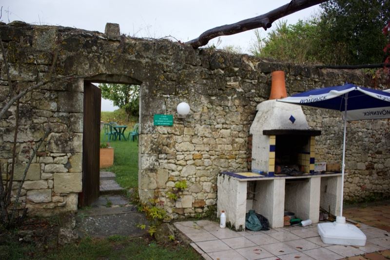 Rustic Stone Wall Outdoor Kitchen Patio