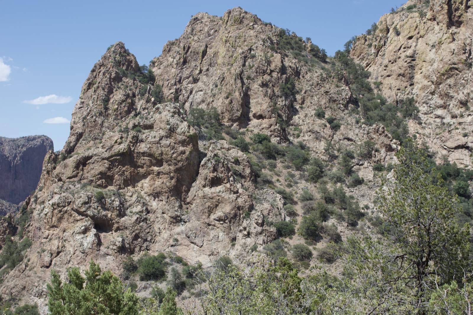 Rugged Rocky Mountain Peak Under Blue Sky