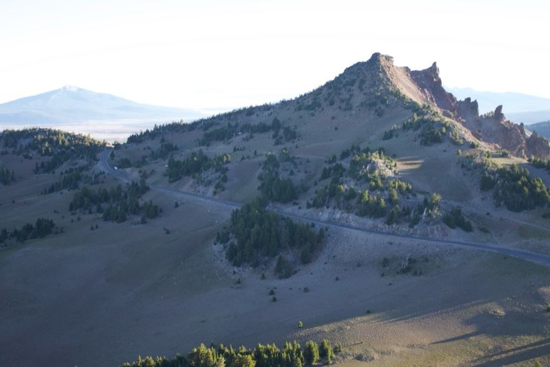 Rugged Mountain Peak Over Grassland