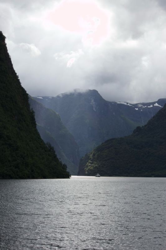 Fjord Mountains Under Cloudy Sky