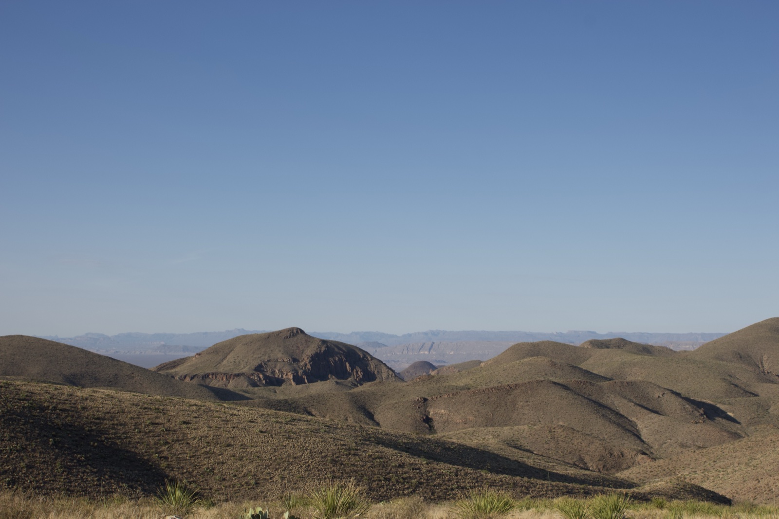 Arid Desert Hills Under Clear Sky