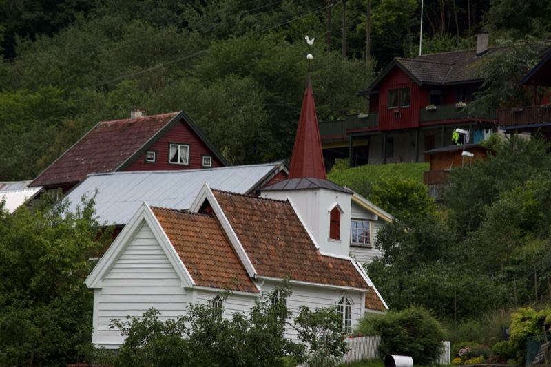 Houses and Church Steeple on Hillside