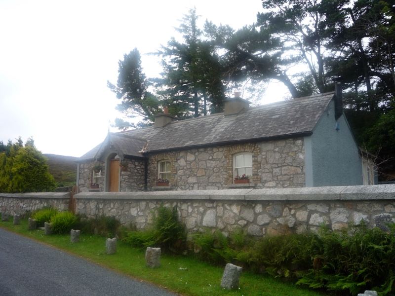 Stone cottage beside rural road