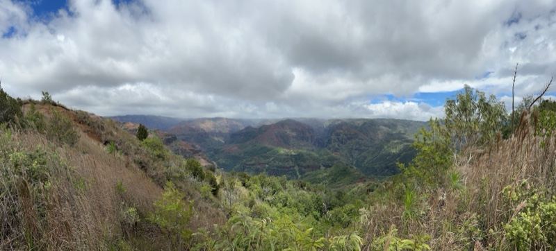 Mountain Valley Under Cloudy Sky