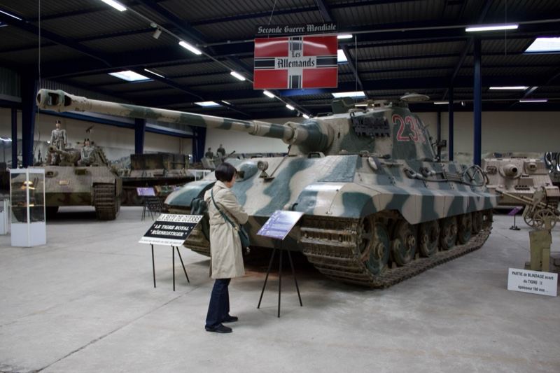 Visitor viewing Tiger tank in museum