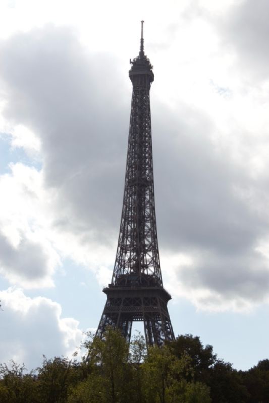 Eiffel Tower Silhouette Against Cloudy Sky