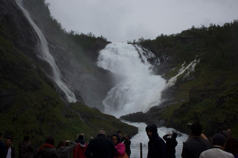 Waterfall View with Tourists Below