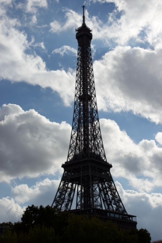 Eiffel Tower Silhouette Against Cloudy Sky