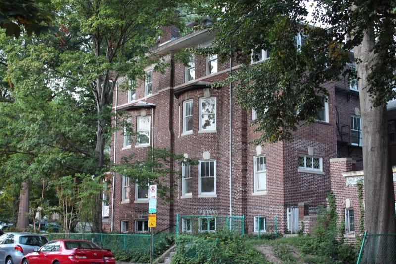 Brick Apartment Building Among Trees