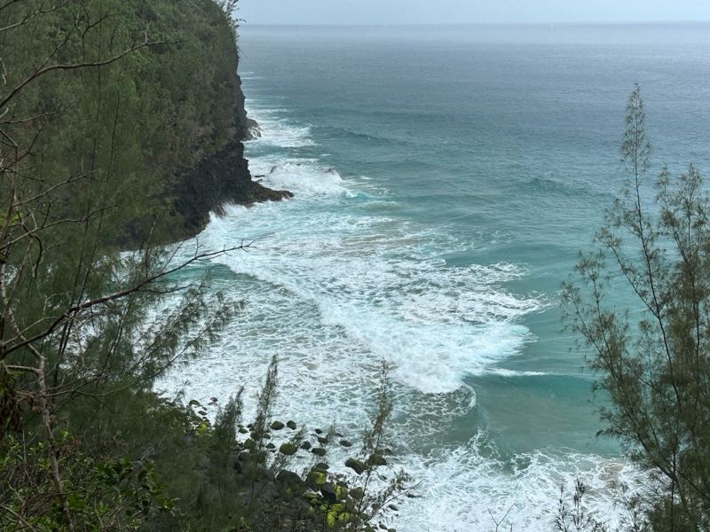 Ocean Waves Crashing Against Cliff