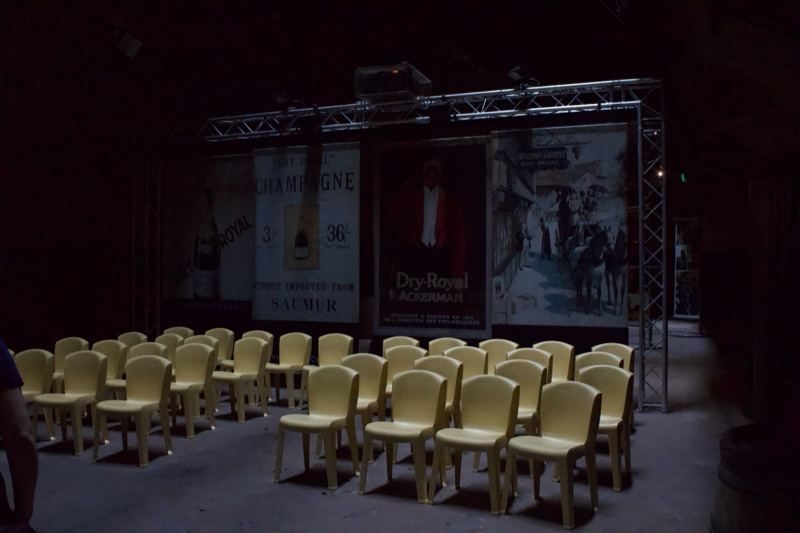 Empty auditorium with yellow chairs