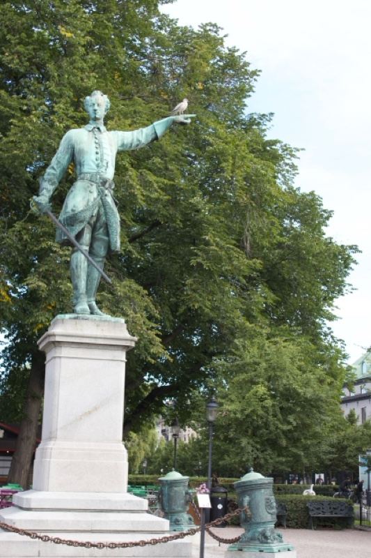 Bronze Statue in Park with Trees