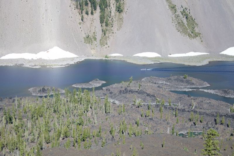 Aerial view of alpine lake and barren slopes
