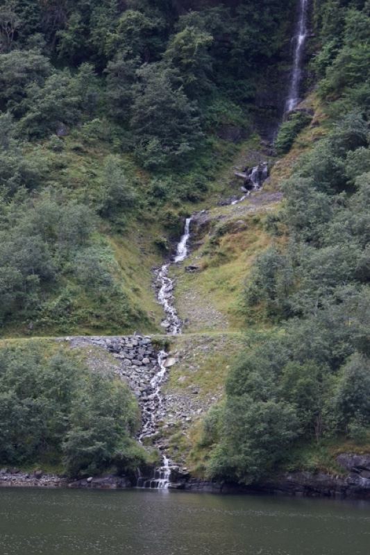 Waterfall Cascading Into Fjord Lake