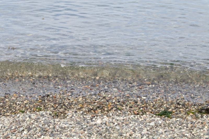 Pebble Shore Meeting Calm Water