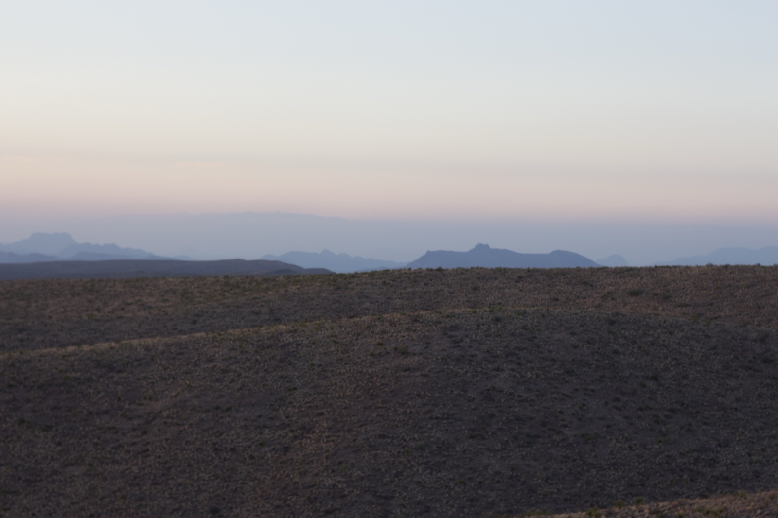 Desert Hills Under Twilight Sky