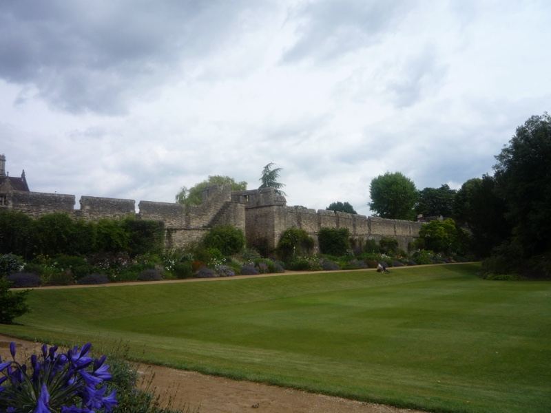 Castle Wall Over Green Lawn