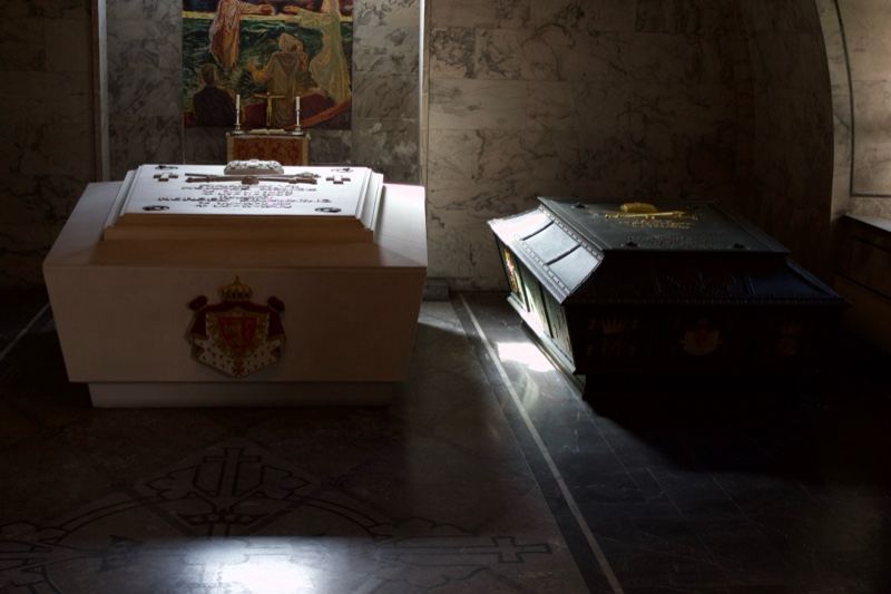 Two sarcophagi in dim chapel interior