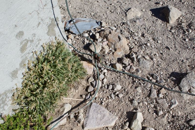Rocks and cable on dry ground