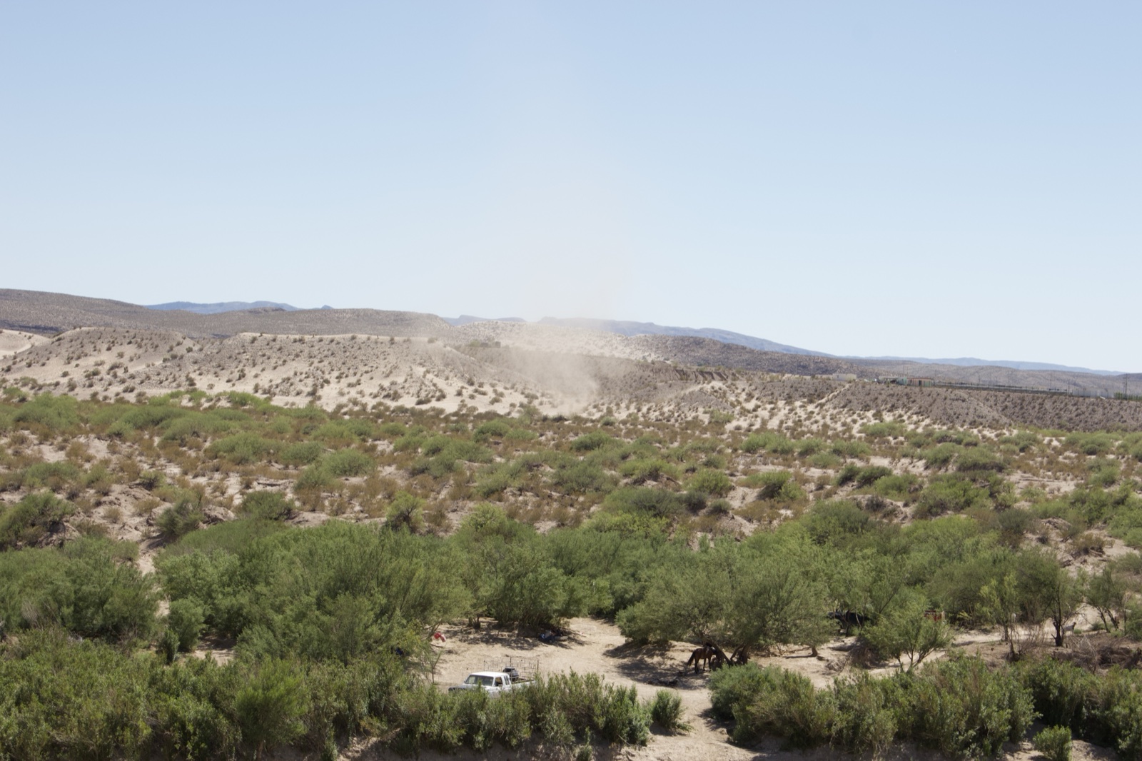 Desert Dust Devil Over Arid Landscape