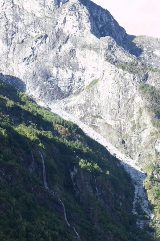 Rugged Mountain Slope with Waterfall