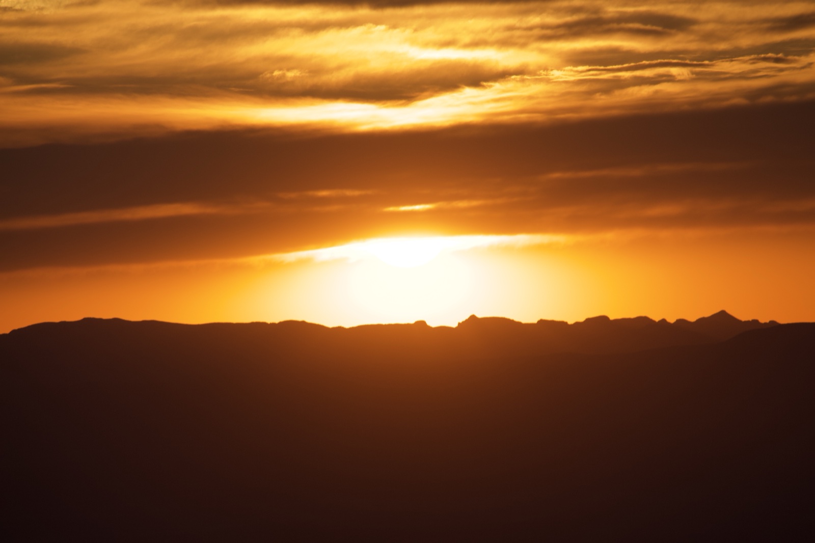 Sunset Over Mountain Silhouette